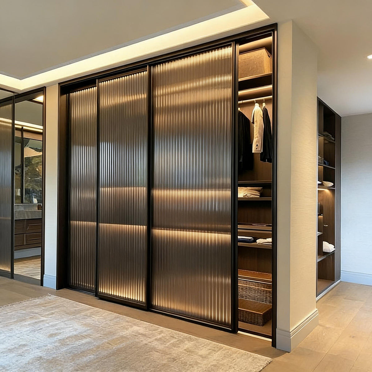 Luxury ribbed glass sliding wardrobe with internal lighting