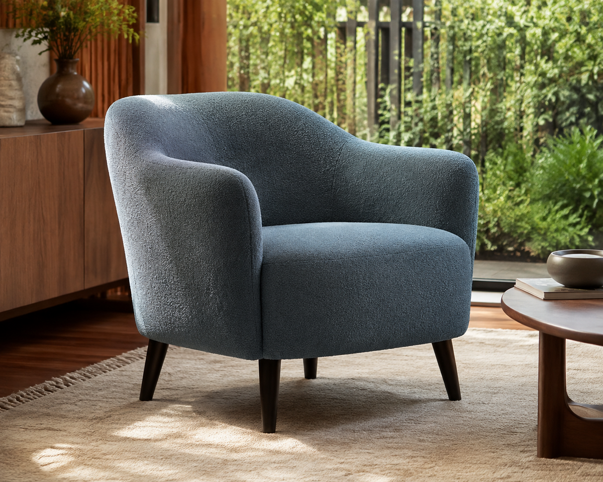 Oslo powder blue upholstered tub chair with dark tapered legs