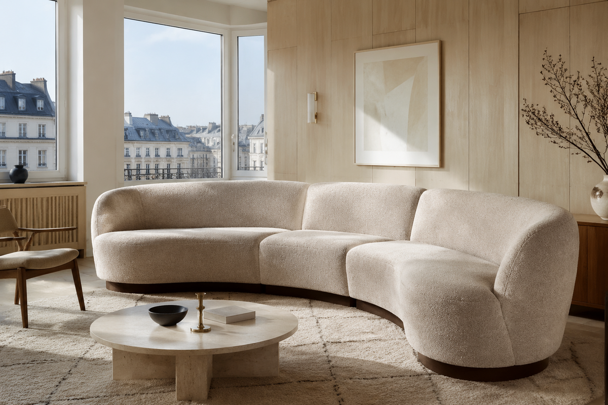 Paris ivory boucle crescent sectional sofa in a light European living room